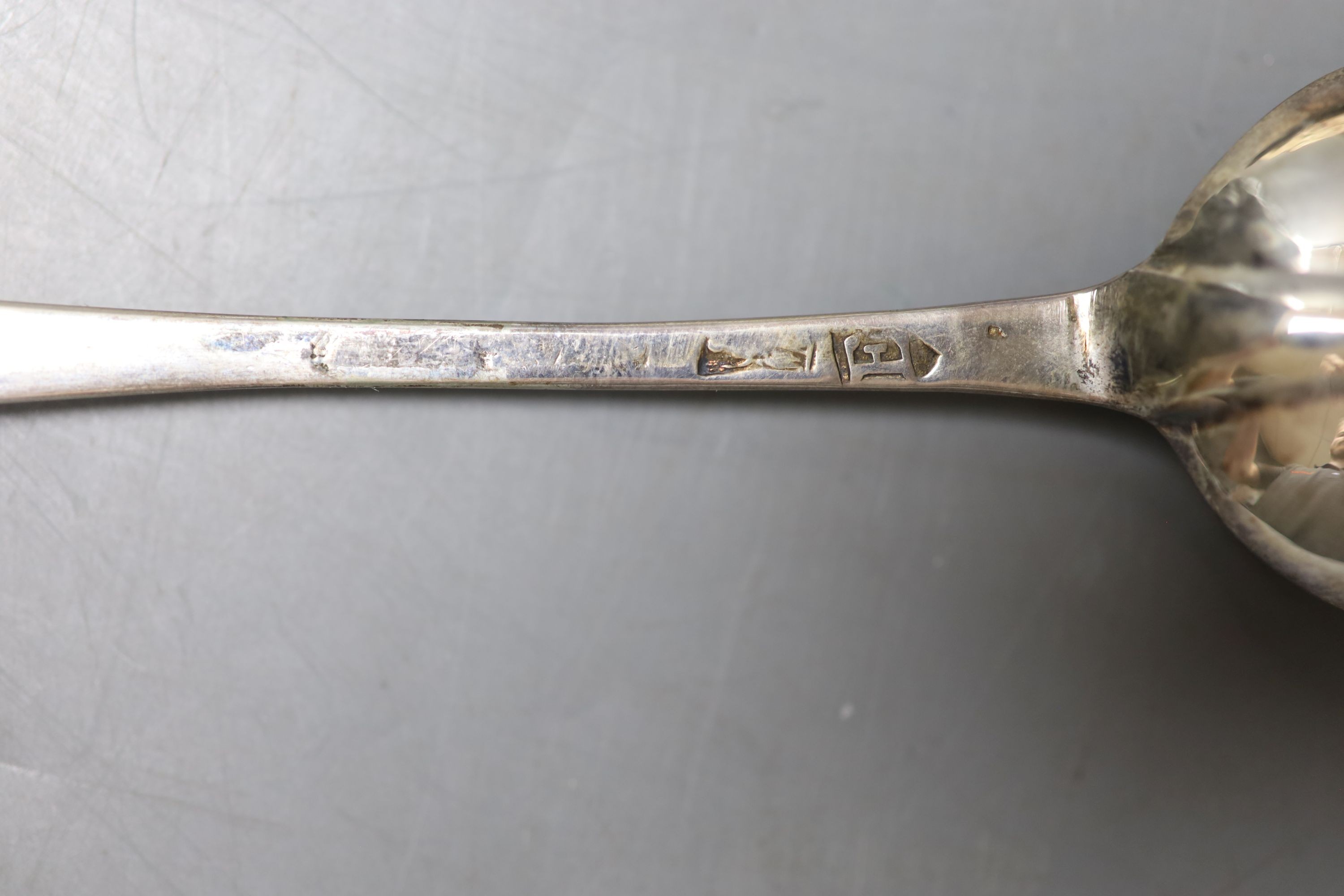 A cased matched pair of 18th century silver Hanovarian rat tail pattern tablespoons, one date for London, 1720, (marks pinched and rubbed), 19.5cm, 95 grams.